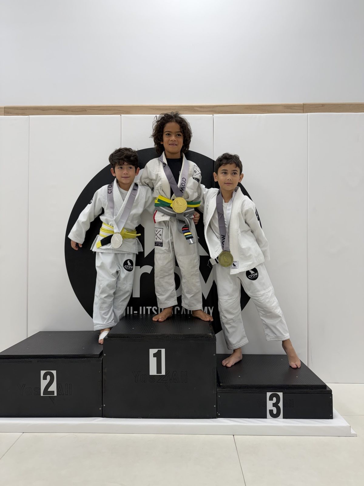 EVR1 Kids Jiu-Jitsu students competing at a youth Brazilian Jiu-Jitsu tournament.