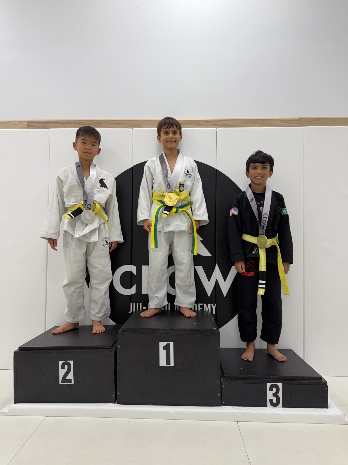 EVR1 Kids Jiu-Jitsu students competing at a youth Brazilian Jiu-Jitsu tournament.