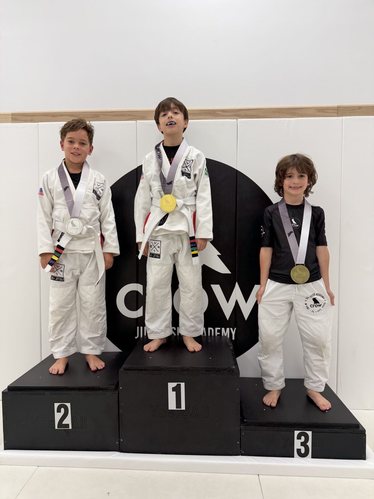 EVR1 Kids Jiu-Jitsu students competing at a youth Brazilian Jiu-Jitsu tournament.