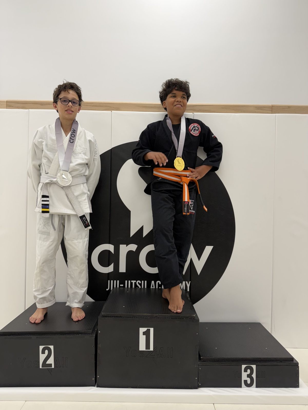 EVR1 Kids Jiu-Jitsu students competing at a youth Brazilian Jiu-Jitsu tournament.
