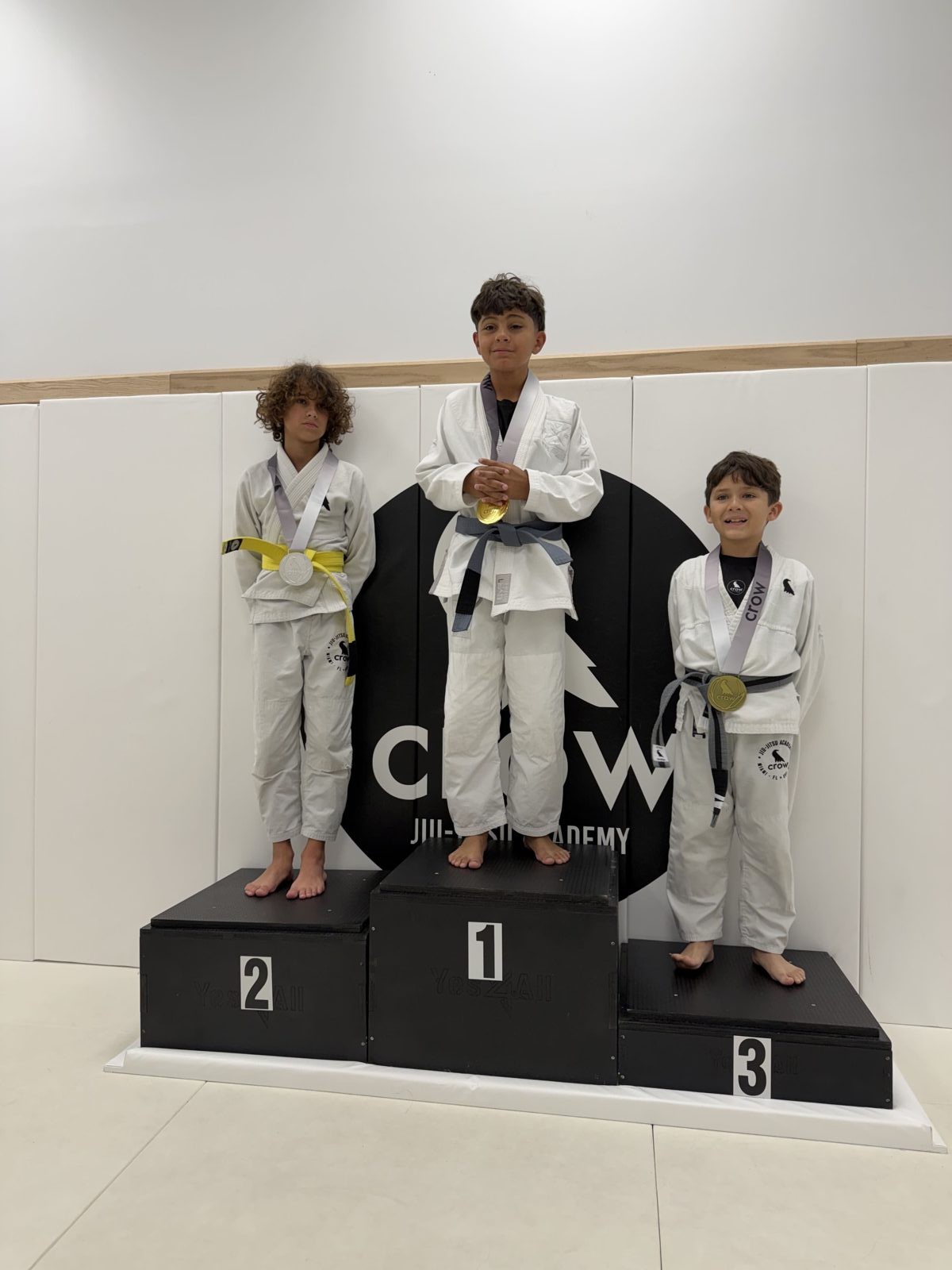 EVR1 Kids Jiu-Jitsu students competing at a youth Brazilian Jiu-Jitsu tournament.